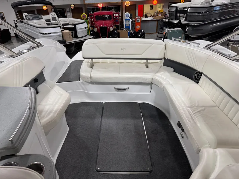 Slide: The Image of 2007 Cobalt 302 BR boat interior with white leather seating and modern design. - 19