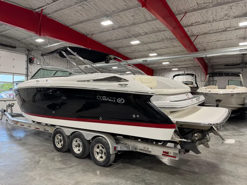 Slide: The Image of 2007 Cobalt 302 BR boat on trailer in indoor storage facility. - 4