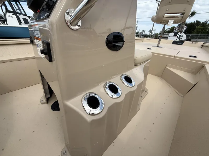 Slide: The Image of 2025 G3 Bay 17 boat interior with rod holders and seating. - 6