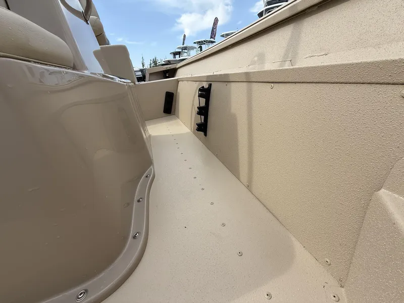 Slide: The Image of Interior view of a 2025 G3 Bay 17 boat, showcasing seating and deck details. - 8