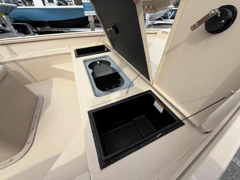 Slide: The Image of Open storage compartments on a 2025 G3 Bay 17 boat deck. - 9