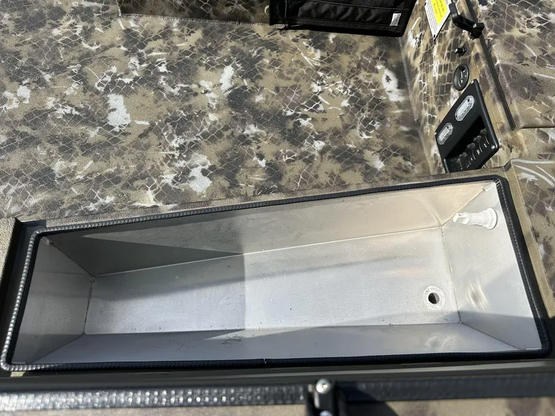 Slide: The Image of Interior of 2025 Excel Viper F4 1751 boat with camouflage design and storage compartment. - 6