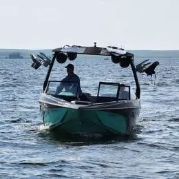 Slide: The Image of 2022 Tigé Z3 boat cruising on open water, front view. - 5