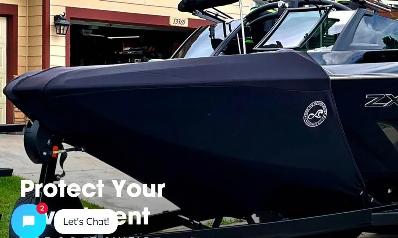 Slide: The Image of 2022 Tigé Z3 boat with cover on trailer, parked in driveway. - 6