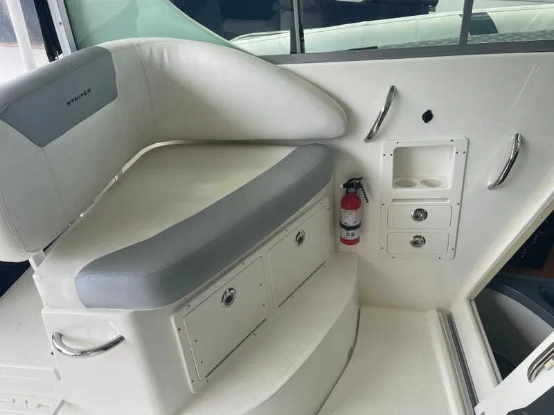 Slide: The Image of 2015 Seaswirl Striper Alaskan Edition boat interior with seating and storage compartments. - 10