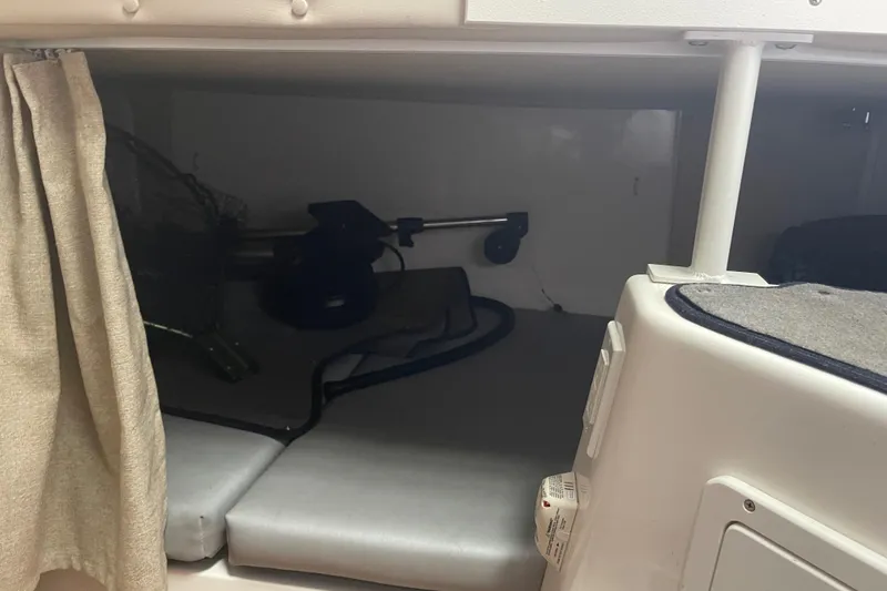 Slide: The Image of 2015 Seaswirl Striper Alaskan Edition cabin interior with storage and seating area. - 17