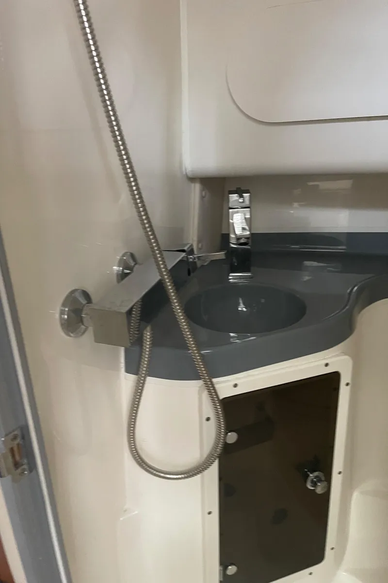 Slide: The Image of 2015 Seaswirl Striper Alaskan Edition boat interior with sink and showerhead. - 19