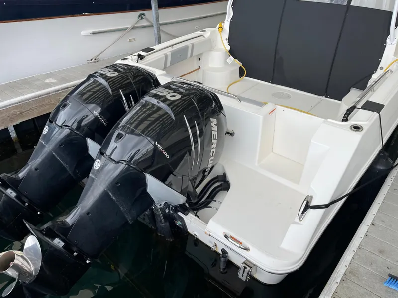 Slide: The Image of 2015 Seaswirl Striper Alaskan Edition boat with dual Mercury outboard engines. - 22