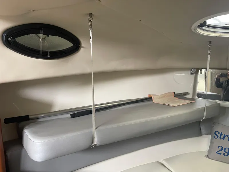 Slide: The Image of Interior of 2015 Seaswirl Striper Alaskan Edition boat, featuring seating and storage. - 5