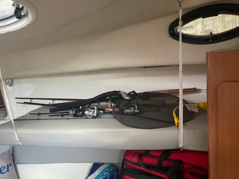 Slide: The Image of Interior of 2015 Seaswirl Striper Alaskan Edition with fishing gear and storage. - 6