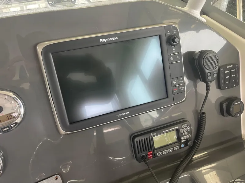 Slide: The Image of Control panel of 2015 Seaswirl Striper Alaskan Edition with Raymarine display and radio equipment. - 9