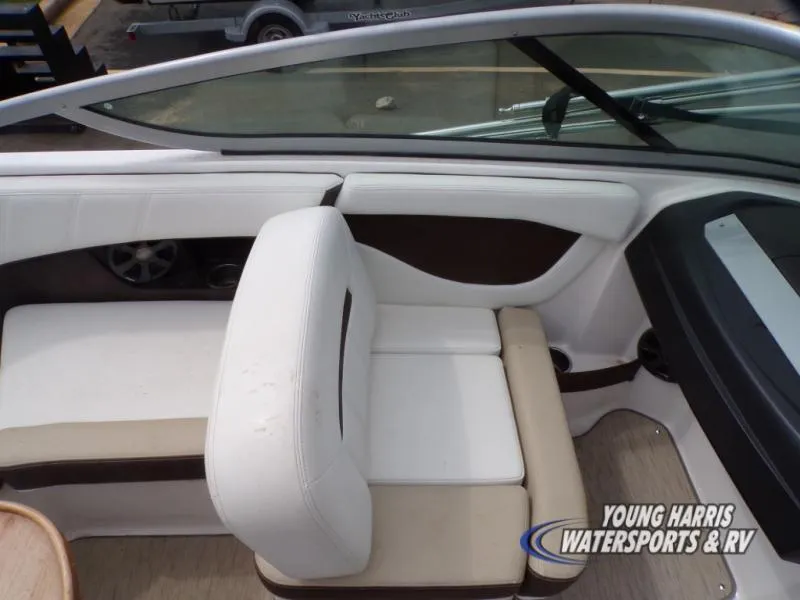 Slide: The Image of Interior of a 2017 Regal 2000 ES boat with white seating and dashboard. - 14