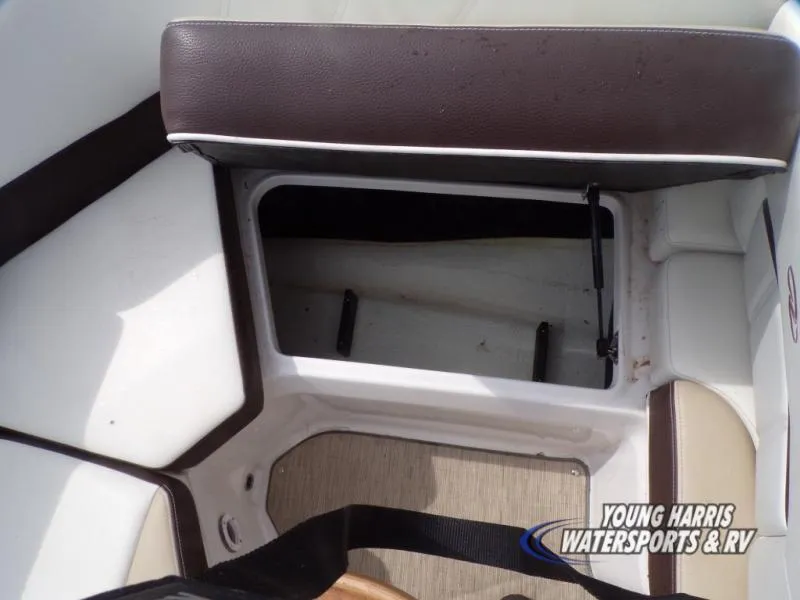 Slide: The Image of 2017 Regal 2000 ES boat interior storage compartment with cushioned seating. - 15