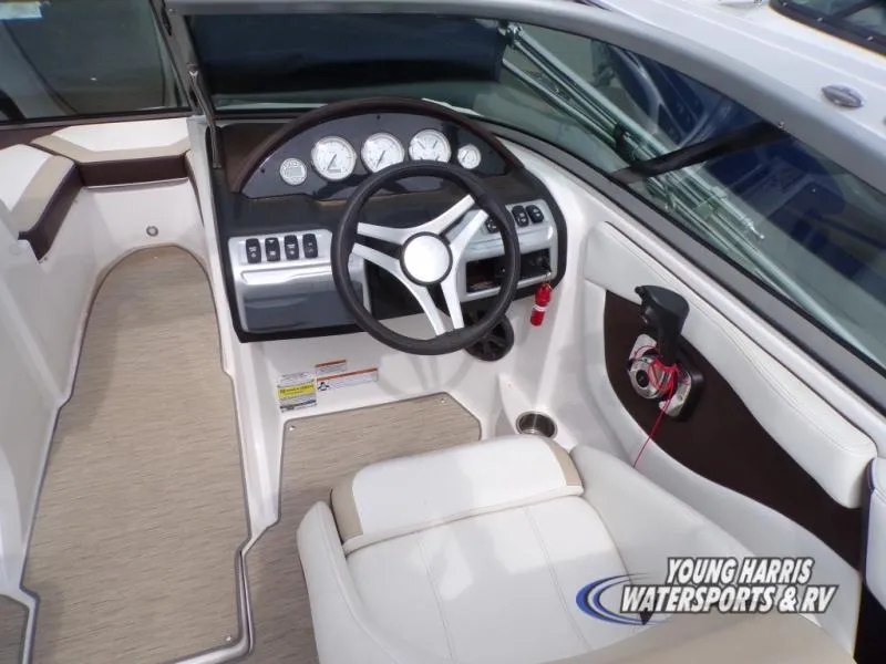 Slide: The Image of 2017 Regal 2000 ES boat interior with steering wheel and dashboard controls. - 8