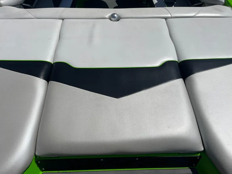 Slide: The Image of 2014 Moomba Mobius LSV boat seat with white and black upholstery. - 16