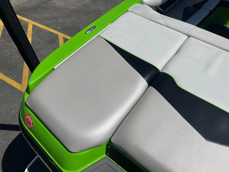 Slide: The Image of 2014 Moomba Mobius LSV boat with green and gray seating detail. - 17