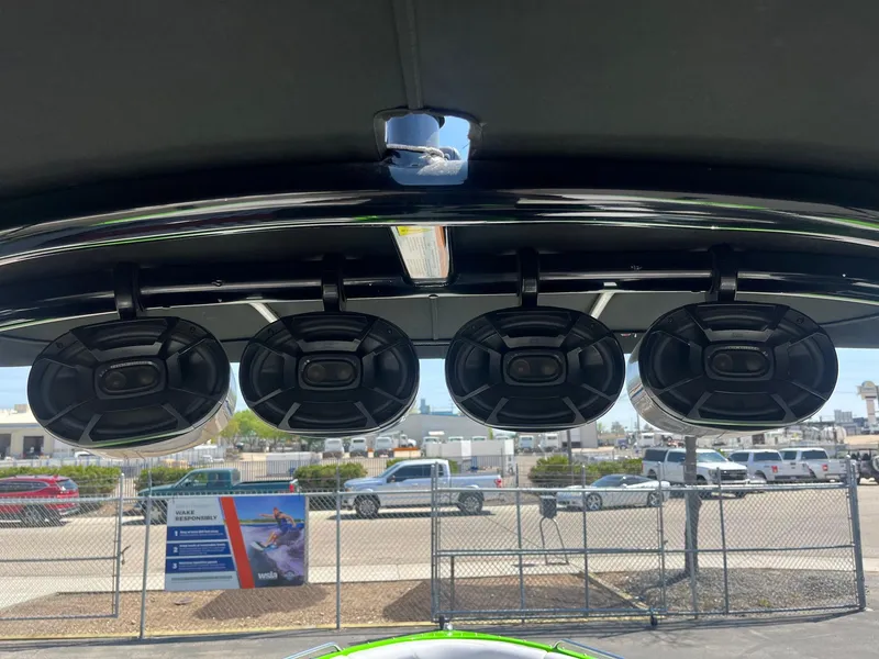 Slide: The Image of Four speakers mounted on a 2014 Moomba Mobius LSV boat's wakeboard tower. - 34