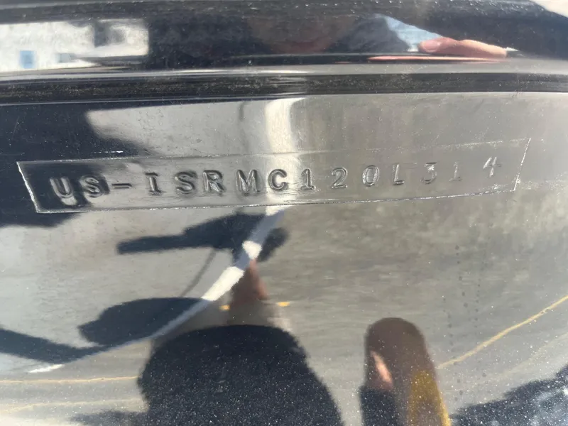 Slide: The Image of 2014 Moomba Mobius LSV hull identification number (HIN) displayed on black surface. - 36