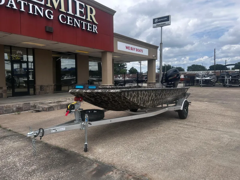 Slide: The Image of 2025 Avid 18 Commander boat on trailer outside Premier Boating Center. - 3