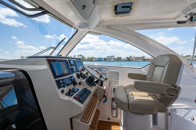 Slide: The Image of 2017 Pursuit 325 OS boat cockpit with modern controls and comfortable seating. - 28
