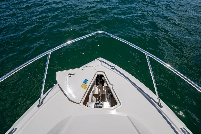 Slide: The Image of Bow view of 2017 Pursuit 325 OS boat on open water. - 5