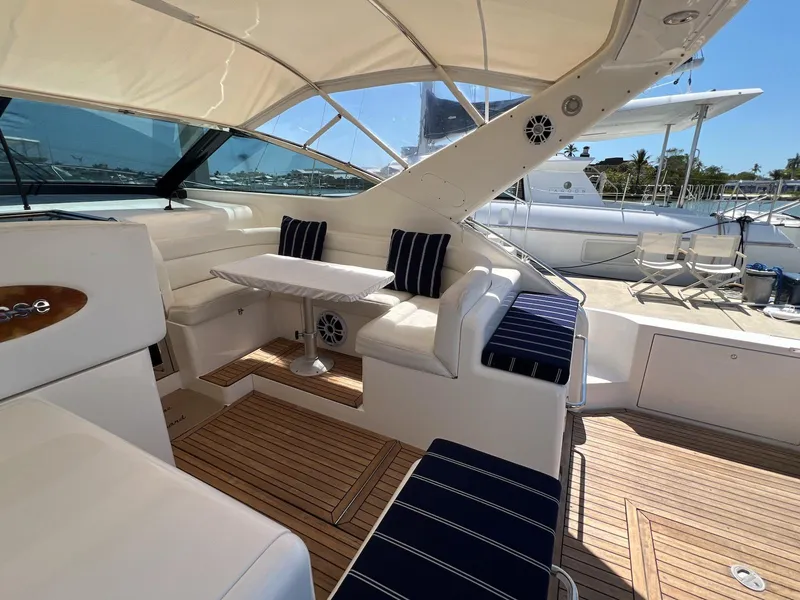 Slide: The Image of Luxurious 2001 Uniesse 42 Open yacht interior with elegant seating and table. - 19