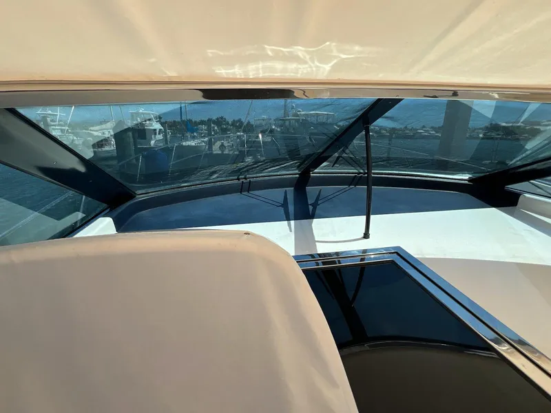 Slide: The Image of 2001 Uniesse 42 Open yacht interior with panoramic windows and sleek design. - 23