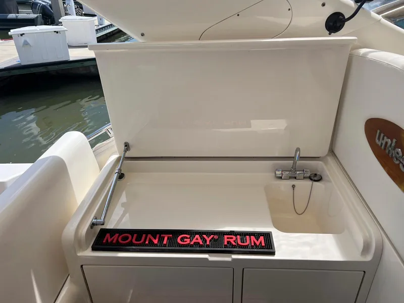 Slide: The Image of 2001 Uniesse 42 Open yacht sink area with Mount Gay Rum mat. - 32