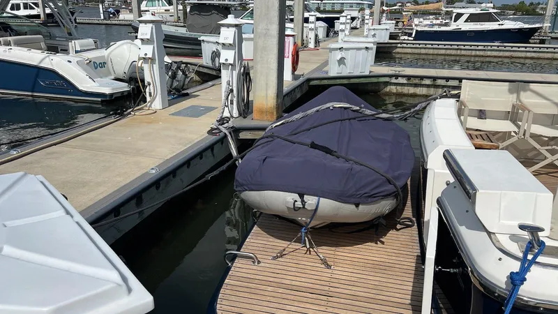 Slide: The Image of Docked Uniesse 42 Open boat, 2001 model, covered and secured at marina. - 33