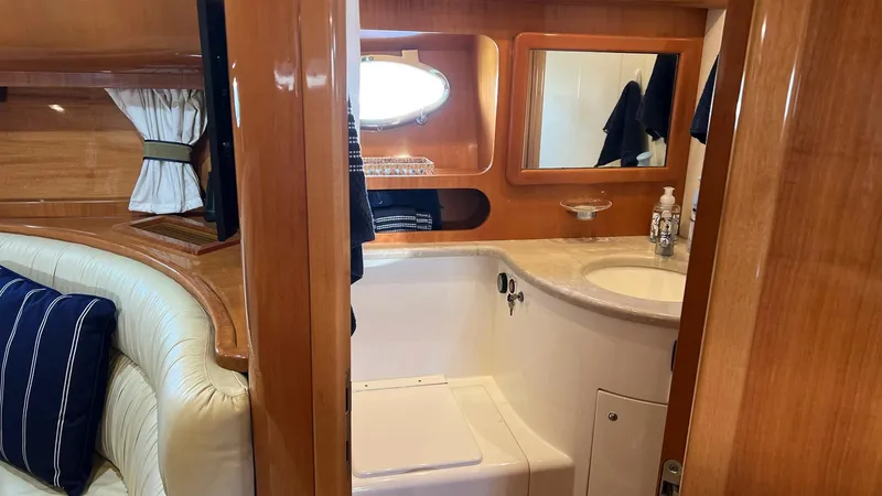 Slide: The Image of Luxurious bathroom interior of 2001 Uniesse 42 Open yacht with wooden finishes. - 43