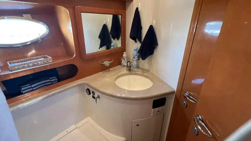 Slide: The Image of Bathroom interior of 2001 Uniesse 42 Open yacht with sink and mirror. - 44