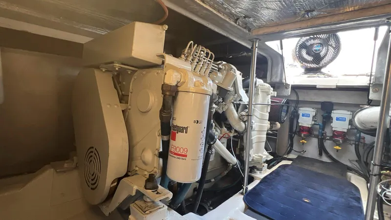 Slide: The Image of Engine room of 2001 Uniesse 42 Open yacht, showcasing mechanical components and equipment. - 47