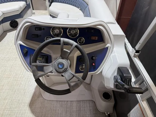 Slide: The Image of 2023 Nepallo Pontoons 18TL helm with Suzuki 60, featuring modern controls and steering wheel. - 11