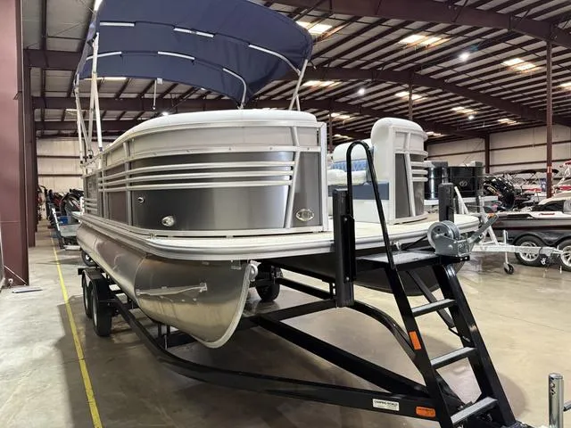 Slide: The Image of 2023 Nepallo Pontoons 18TL with Suzuki 60, displayed indoors on a trailer. - 3