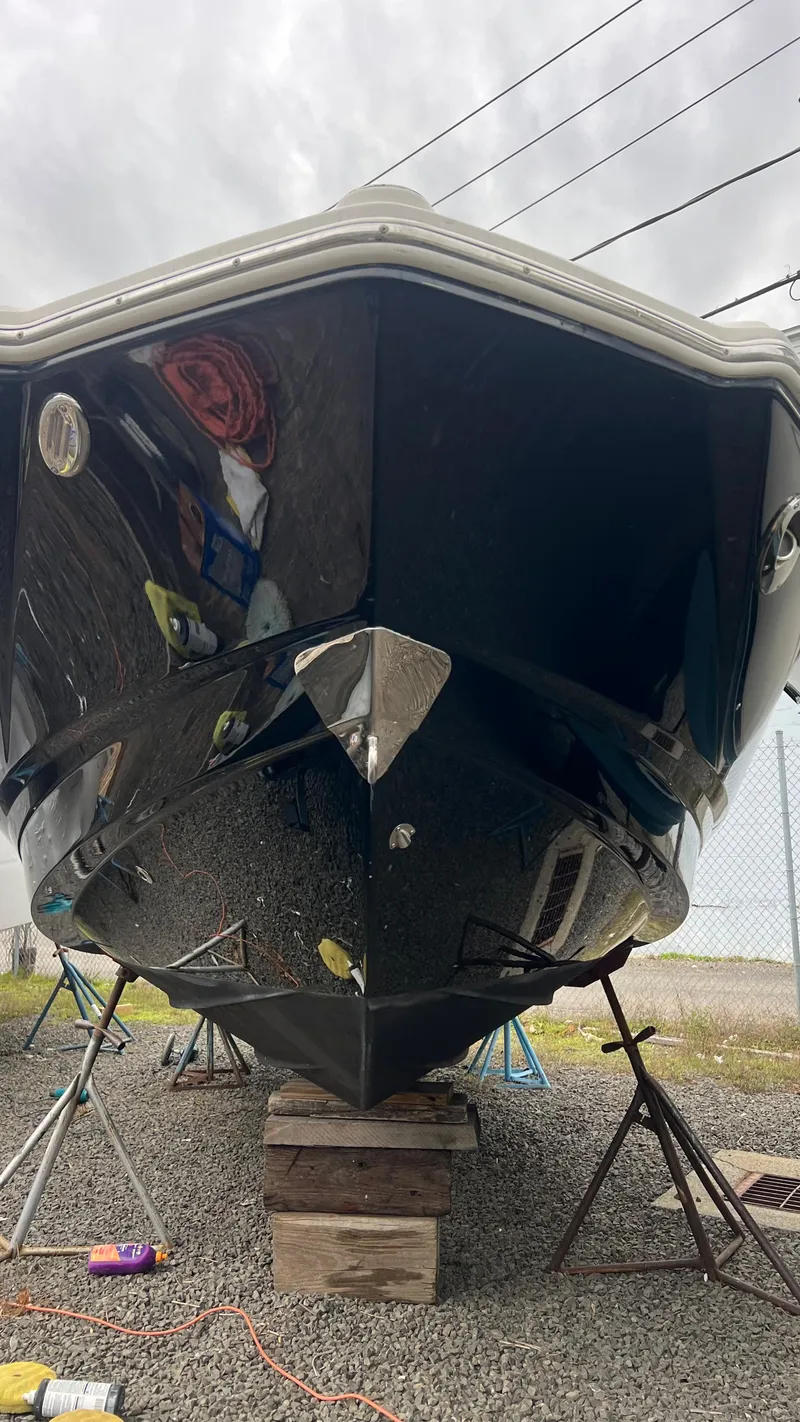 Slide: The Image of 2017 Chaparral 246 SSi boat on stands, viewed from the front, outdoors. - 11