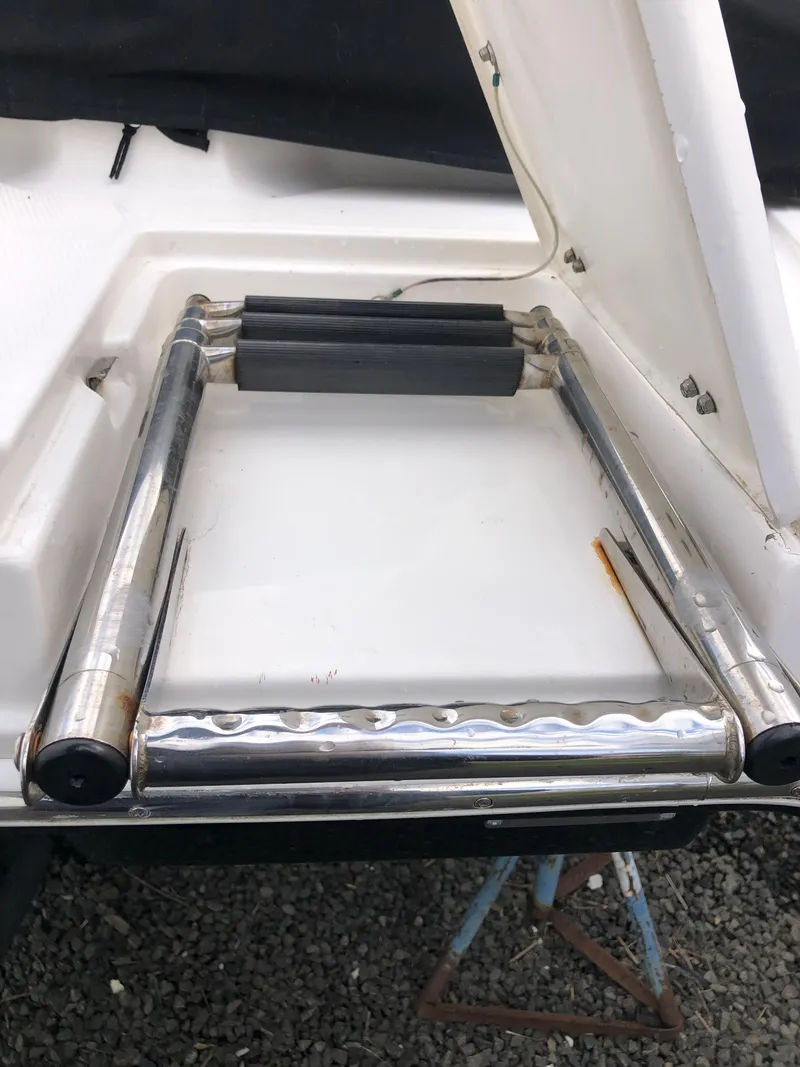 Slide: The Image of 2017 Chaparral 246 SSi boat ladder, stainless steel, folded on deck. - 15
