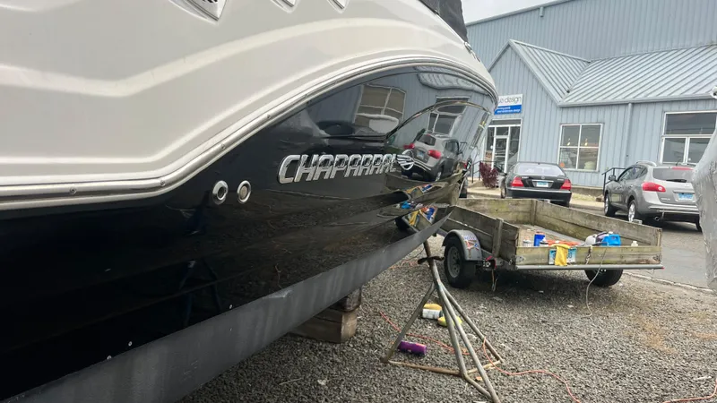Slide: The Image of 2017 Chaparral 246 SSi boat on trailer near industrial building. - 9