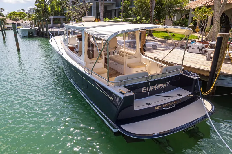 Slide: The Image of 2013 MJM 36z Downeast boat docked in a sunny marina. - 10