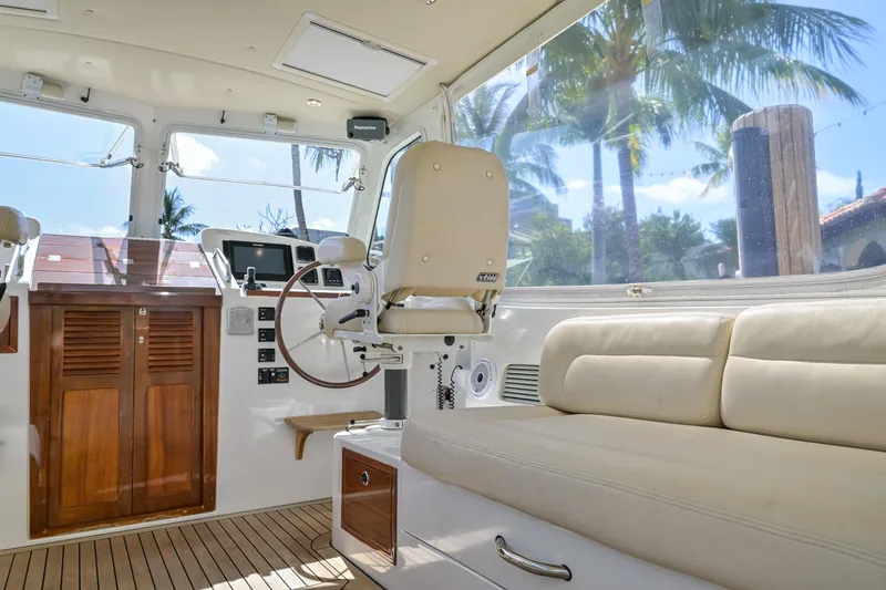 Slide: The Image of Interior of 2013 MJM 36z Downeast yacht with helm, seating, and tropical view. - 16