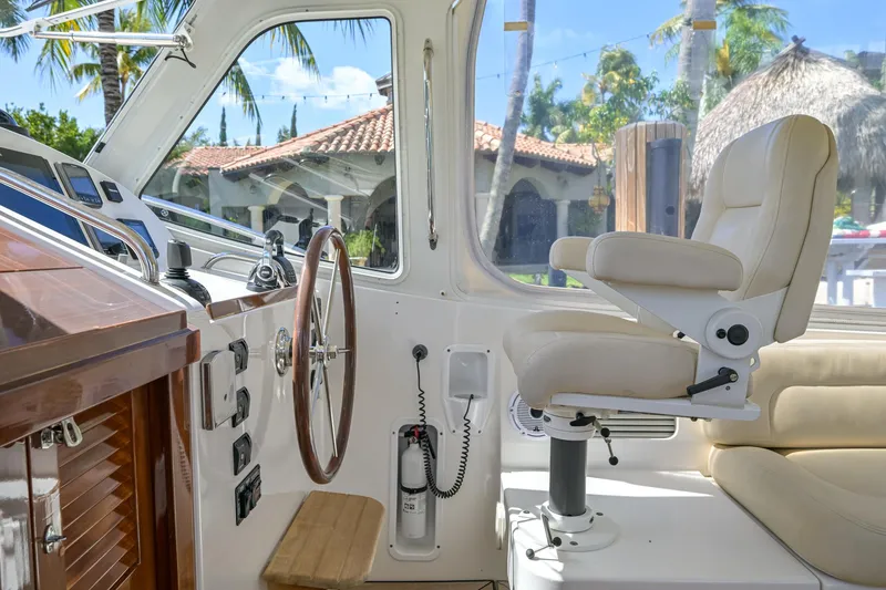 Slide: The Image of Interior of 2013 MJM 36z Downeast boat with steering wheel and captain's chair. - 18