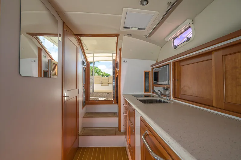 Slide: The Image of Interior of 2013 MJM 36z Downeast yacht with wooden cabinetry and modern amenities. - 20