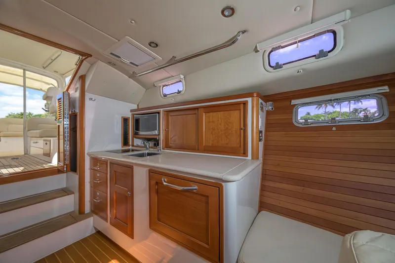 Slide: The Image of Interior of 2013 MJM 36z Downeast yacht with wooden cabinetry and modern amenities. - 24