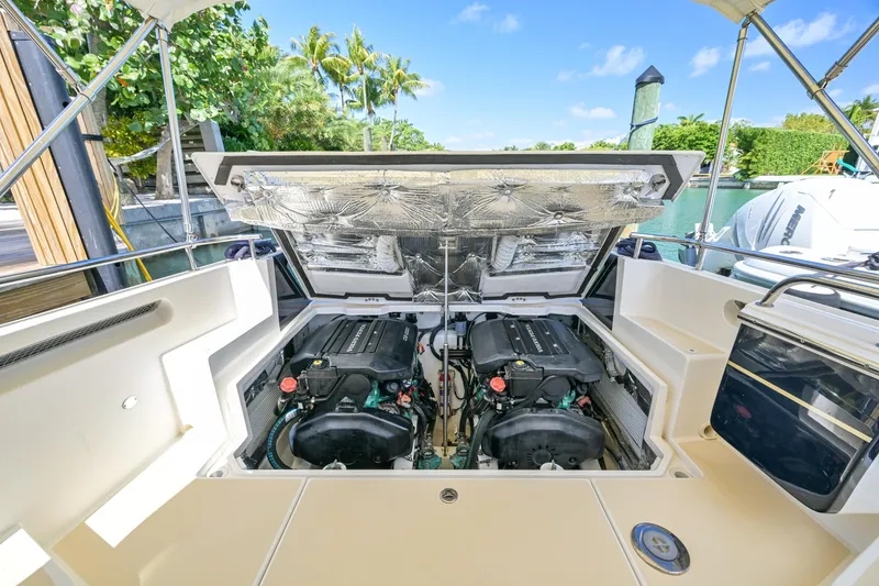 Slide: The Image of 2013 MJM 36z Downeast boat engine compartment with dual engines, dockside view. - 29