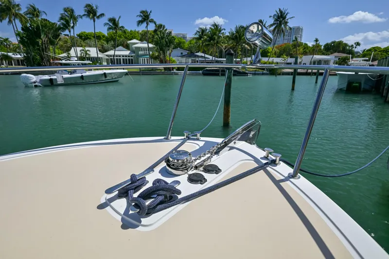 Slide: The Image of 2013 MJM 36z Downeast boat bow with anchor, docked in a tropical marina. - 33