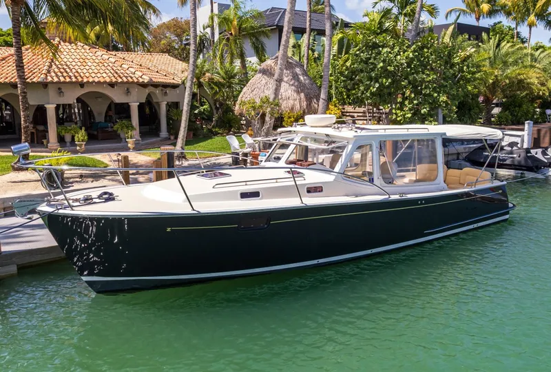 The Image of 2013 MJM 36z Downeast boat docked in tropical marina setting. - 7