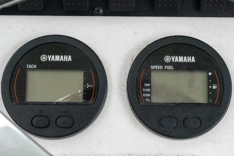 Slide: The Image of Yamaha tachometer and speed fuel gauges on a 2017 Sea Hunt Ultra 225 boat. - 13