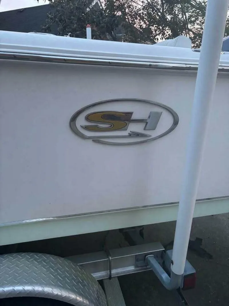 Slide: The Image of 2017 Sea Hunt Ultra 225 boat logo on trailer, close-up view. - 20