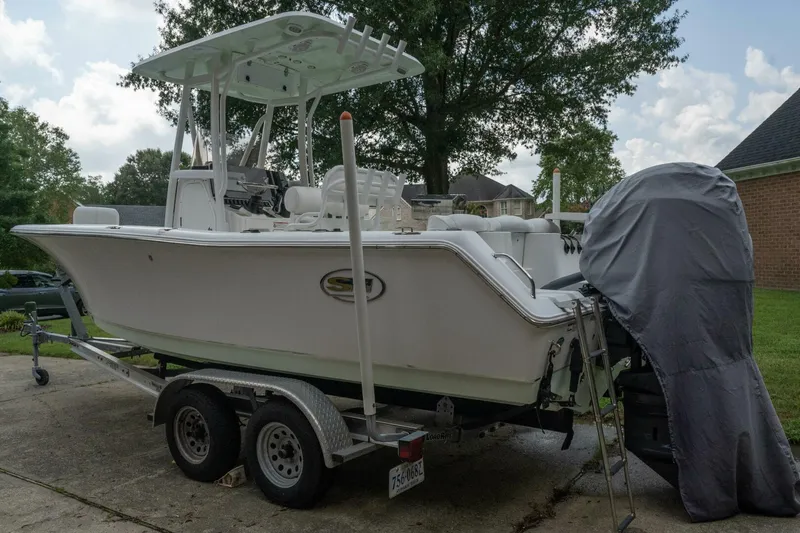 Slide: The Image of 2017 Sea Hunt Ultra 225 boat on trailer, parked in driveway. - 28