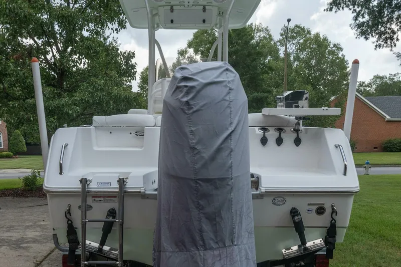 Slide: The Image of 2017 Sea Hunt Ultra 225 boat, rear view, parked in a residential driveway. - 29