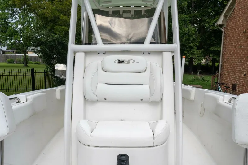 Slide: The Image of 2017 Sea Hunt Ultra 225 boat interior with white seating and console. - 41